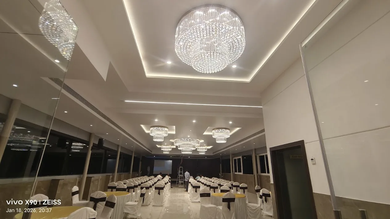Chandelier and ceiling lighting installed inside a banquet hall