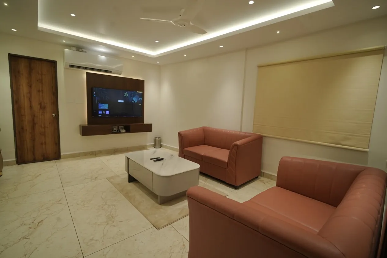 False ceiling cove lighting and downlights installed in a residential living room